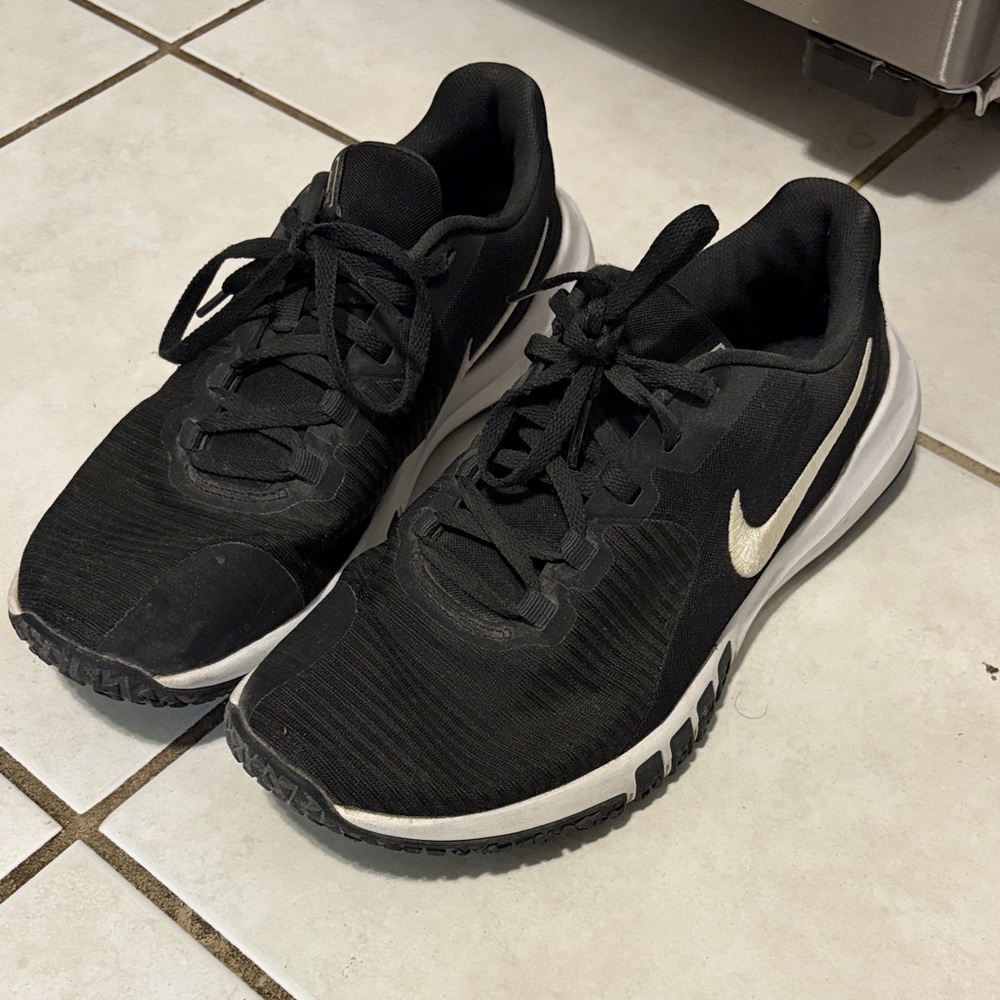 Nike Black Training Sneakers with Metallic Gold Swoosh